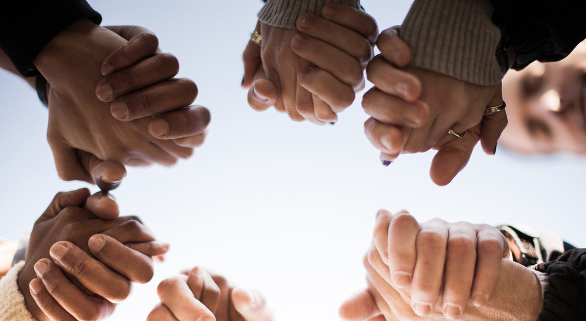 Group holding hands 1160x636