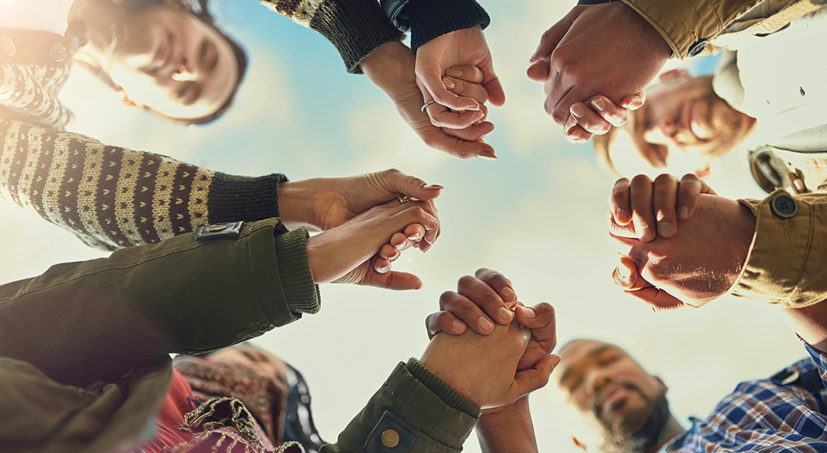 Group holding hands in circle 72px