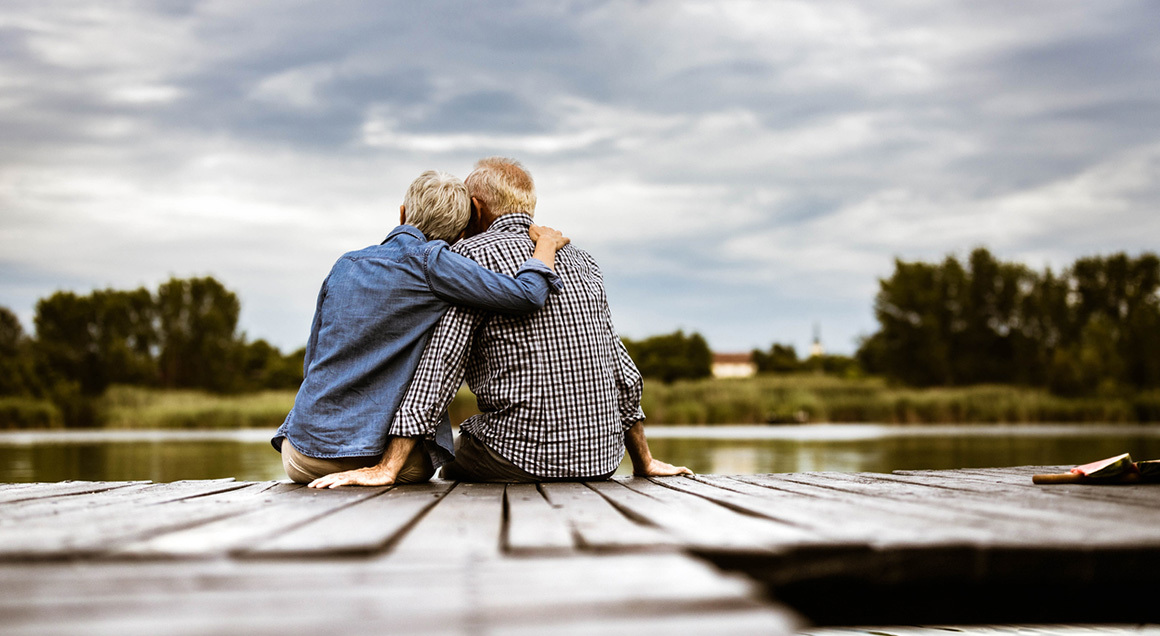 Stock adult couple sitting on dock 72px