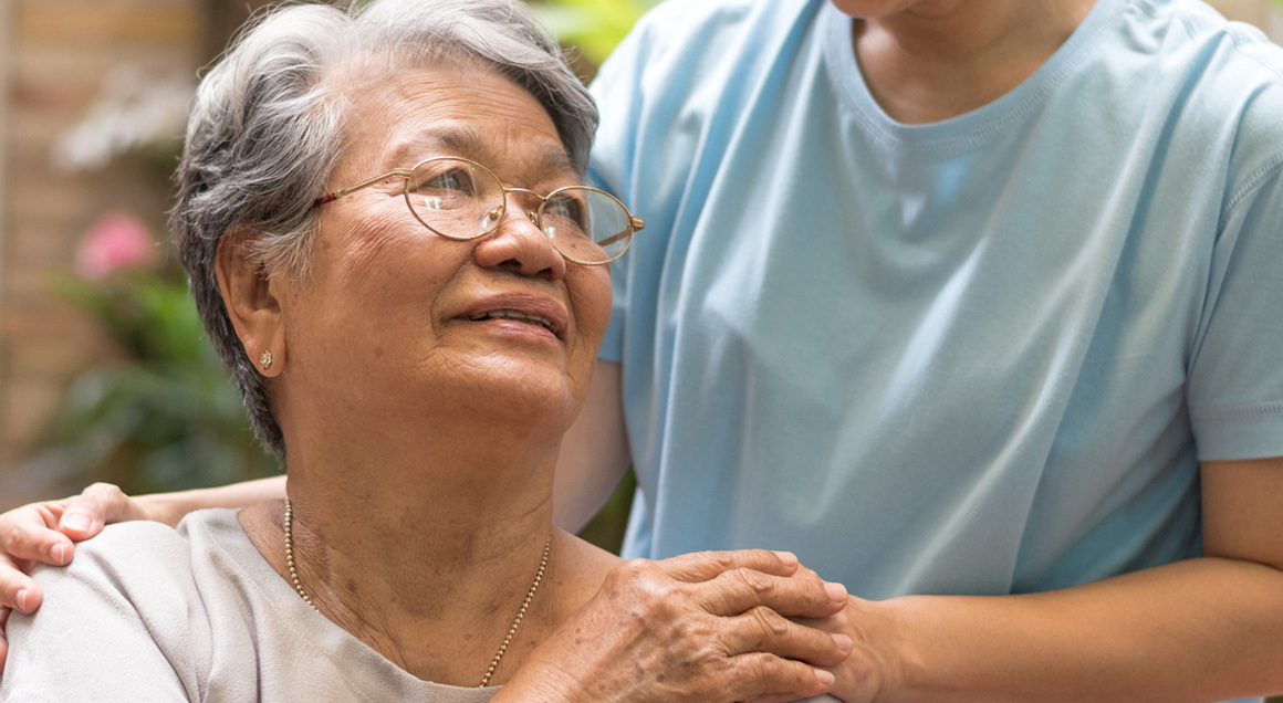 Stock elderly woman with caretaker