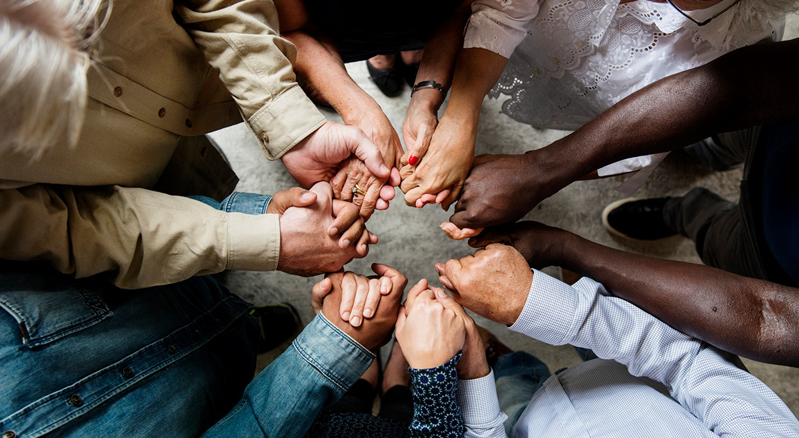 Women locked hands in circle