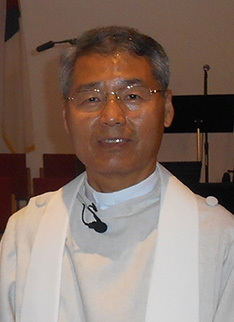 Yohan in clergy robe